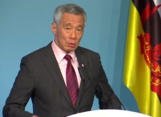 李顯龍提醒民眾，即使已經接種，也應遵守保持社交距離等防疫規定。（路透社資料圖片）